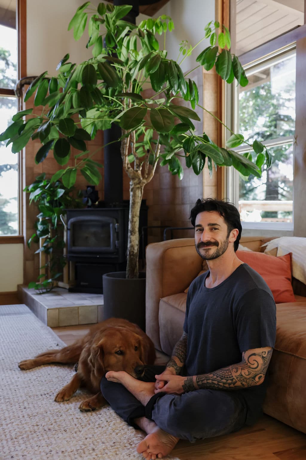 Peter seated at home with Huckleberry