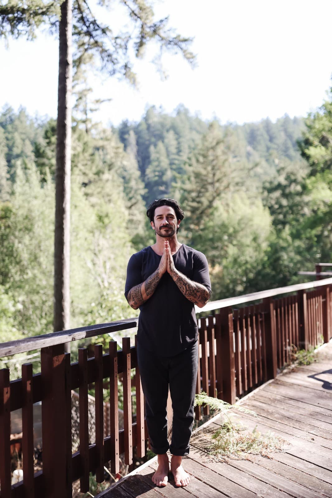 Peter on a deck, hands at his heart